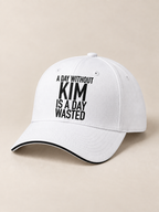 A DAY WITHOUT KIM IS A DAY WASTED cap white generated final