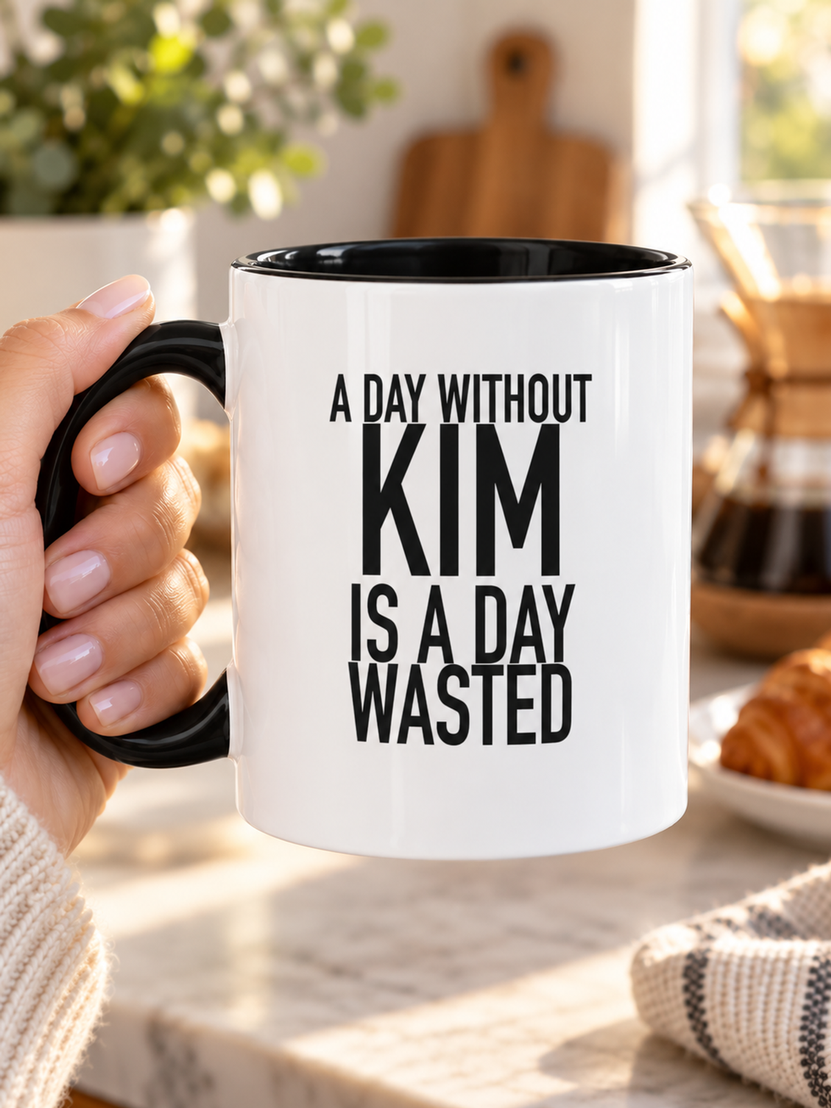 A DAY WITHOUT KIM IS A DAY WASTED mug handheld-black-white AI final 1350x1800