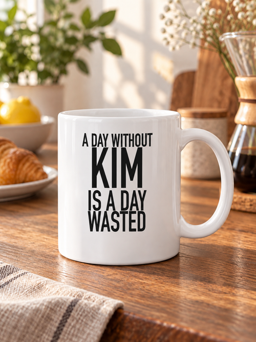 A DAY WITHOUT KIM IS A DAY WASTED mug lifestyle-white AI final 1350x1800
