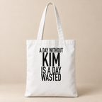 A DAY WITHOUT KIM IS A DAY WASTED tote white mockup