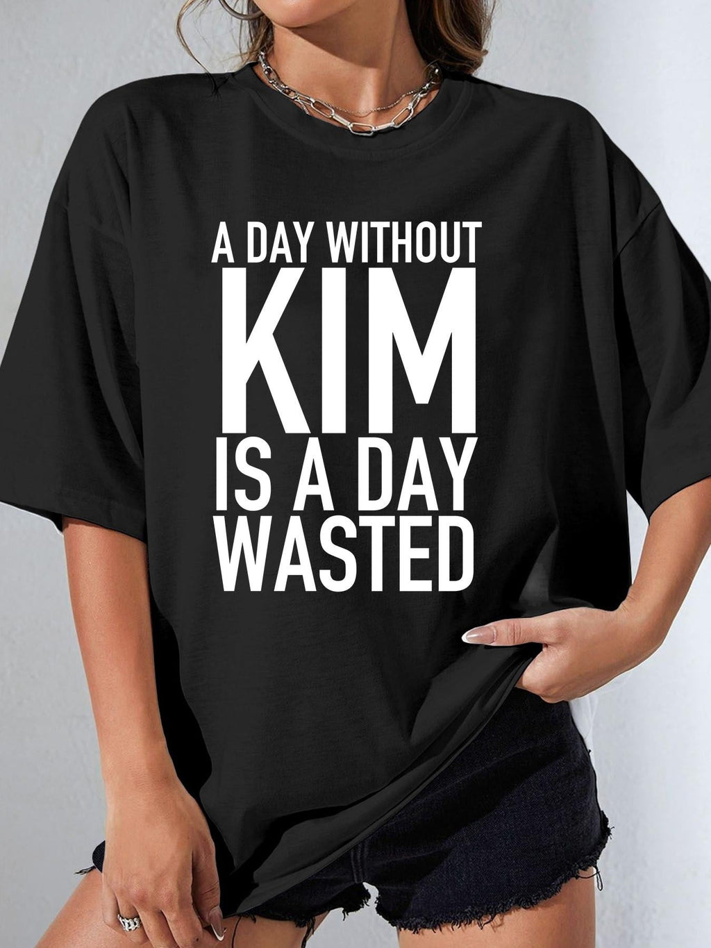 A DAY WITHOUT KIM IS A DAY WASTED women-tshirt black original model 01