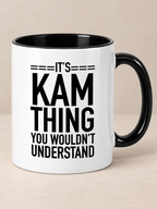 Black and white 11oz mug with It's Kam thing you wouldn't understand quote print on warm greige background