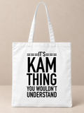 White canvas tote bag with It's Kam thing you wouldn't understand quote print on warm greige background