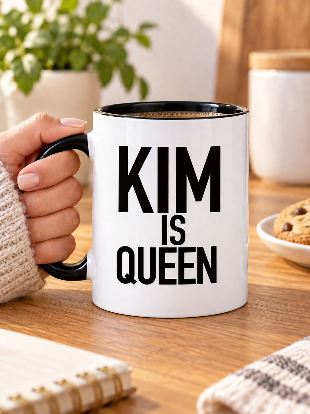 KIM IS QUEEN mug handheld-black-white mockup