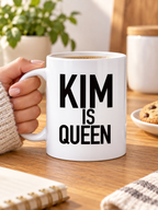 KIM IS QUEEN mug handheld-white mockup